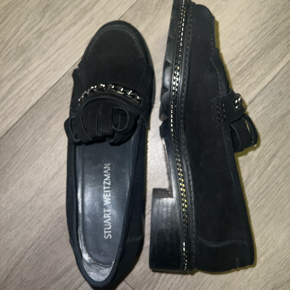 Stuart Weitzman Loafers with a chain detail and tassles